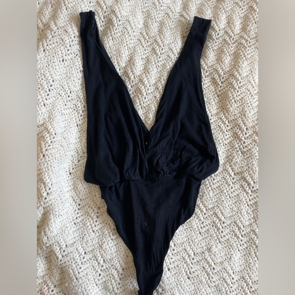 Revolve by the way. Deep VNeck Thong Black Bodysuit (Small)